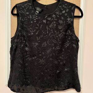Black Sleeveless blouse with button back. Dressy floral pattern. Size 12.